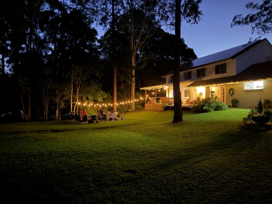 Framehouse studio at 108 Savages Road, Brookfield — an evening gathering on the acreage property
