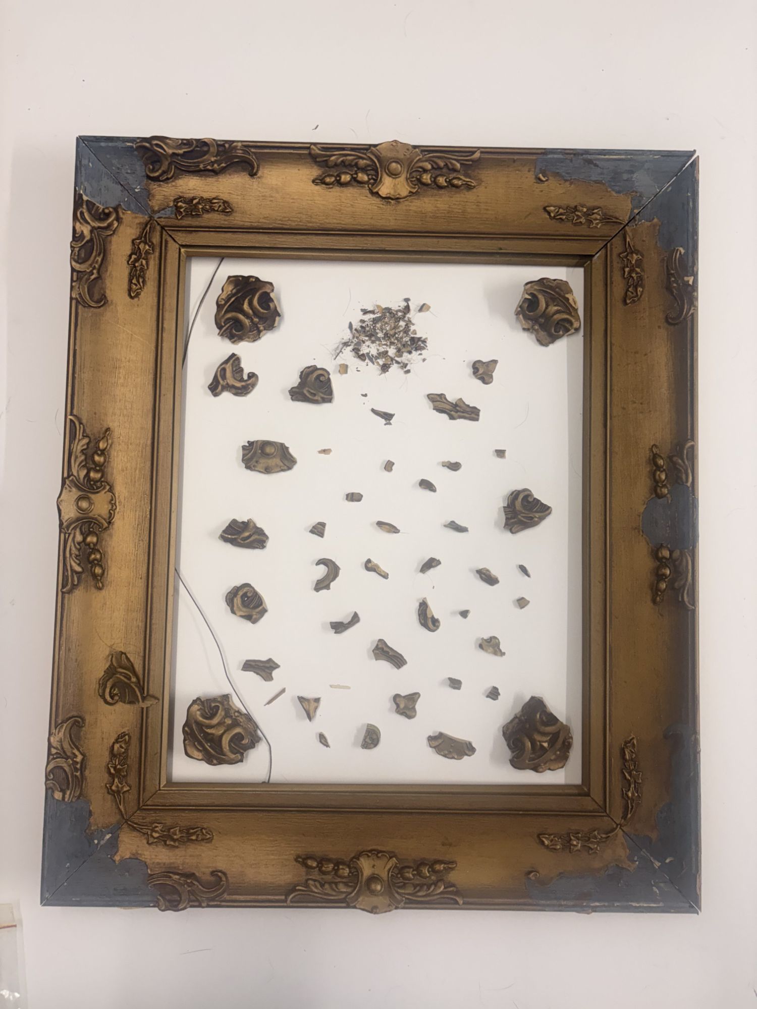 WW1 gilt frame before restoration — shattered moulding